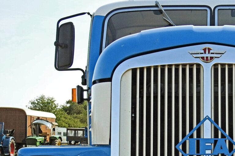 Front of a big rig including the side mirror