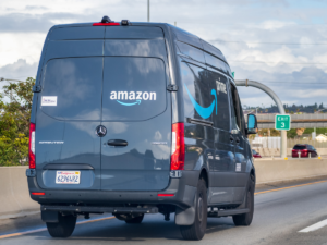 Amazon truck on a highway.